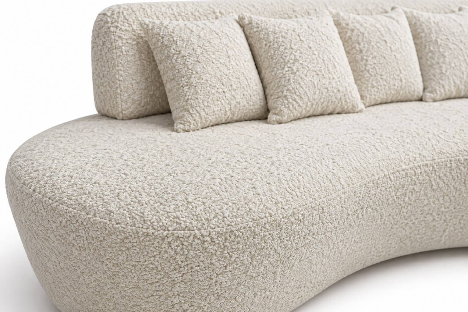 Novo luxo no mercado imobiliário: experiência e bem-estar 3 Detalhe do Sofá Curvo Orgânico Ardena em bouclé Off White, com textura do tecido, costura e almofadas soltas