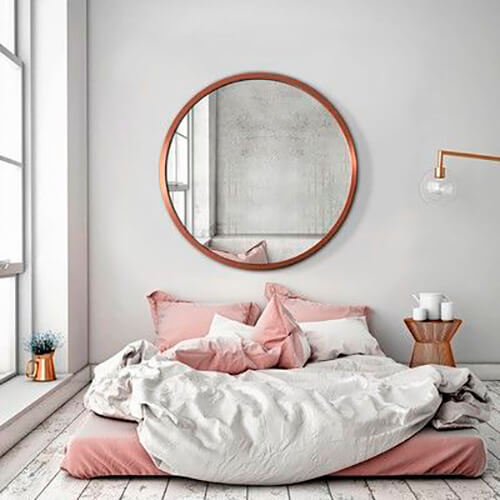 decorar uma apartamento alugado - espelho redondo no quarto